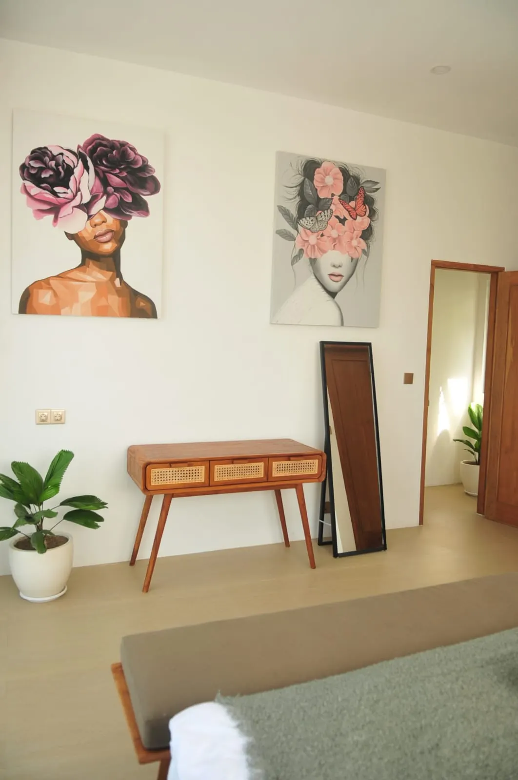 Bedroom desk with artwork and mirror