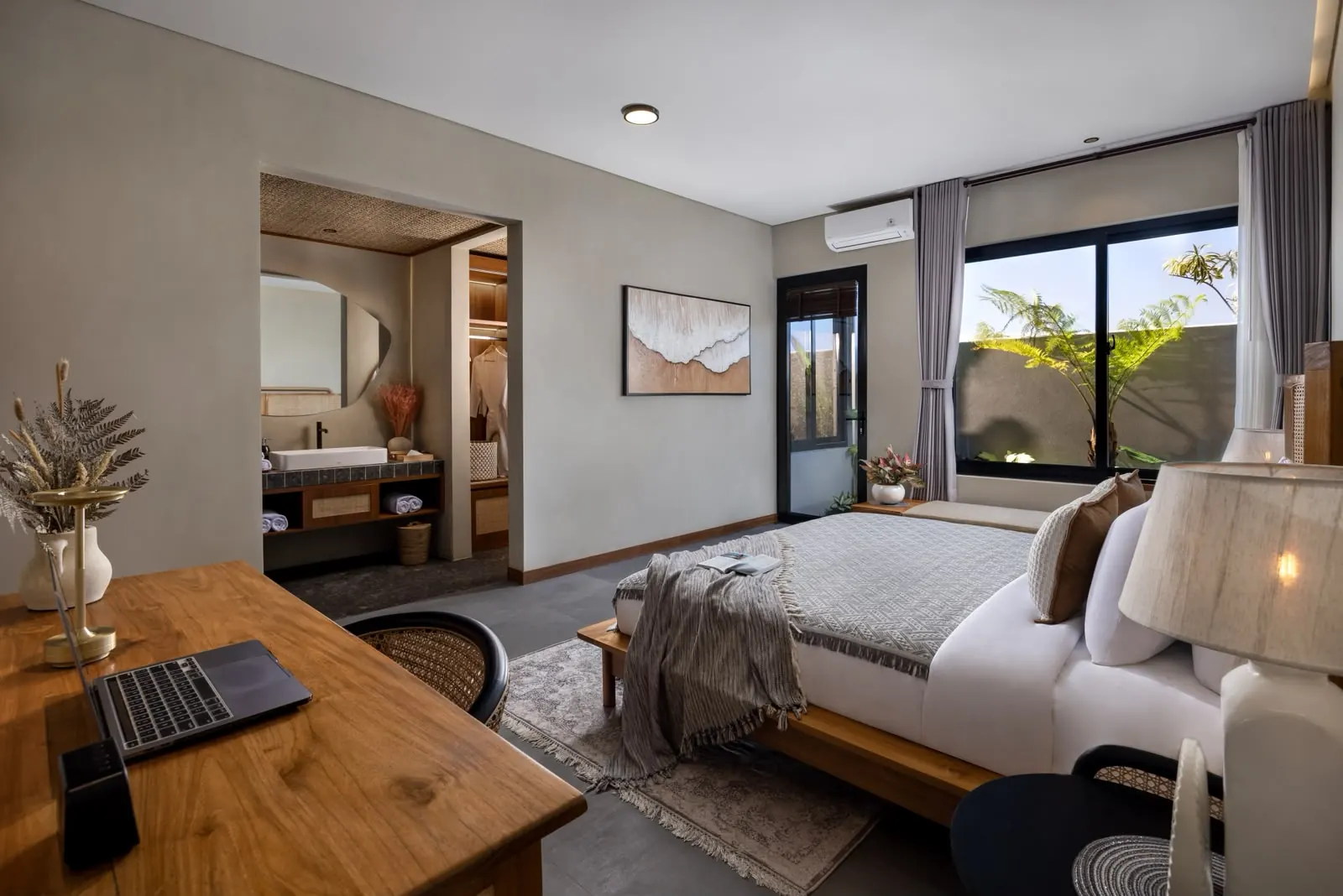 Bedroom with work desk and garden windows