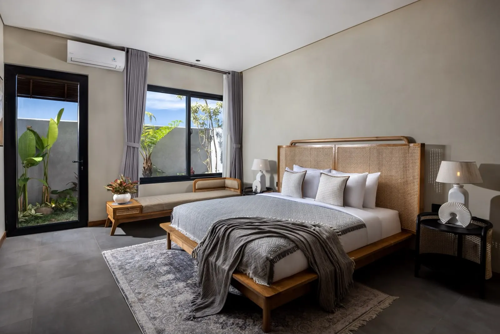 Bedroom with wooden bed and balcony door