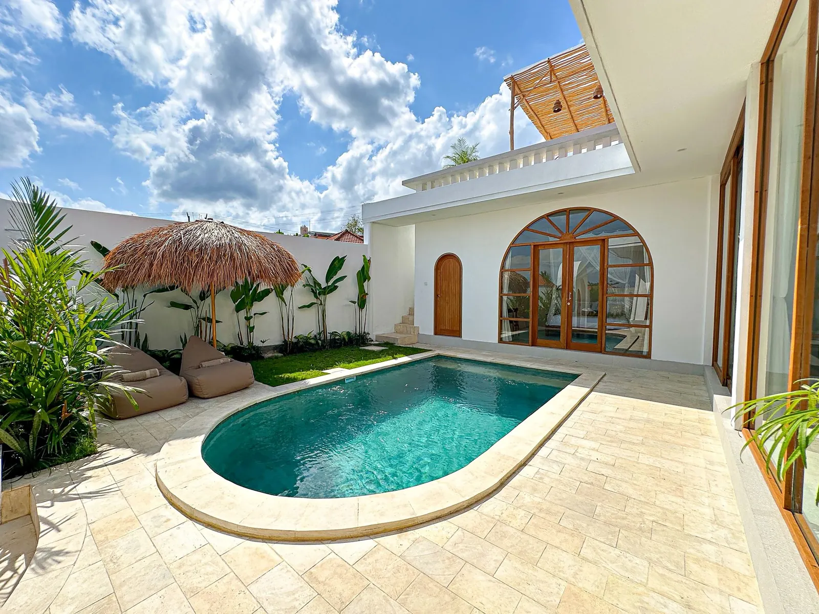 Private pool courtyard with arched doors and rooftop terrace – 2 bedroom villa in Pererenan, Canggu