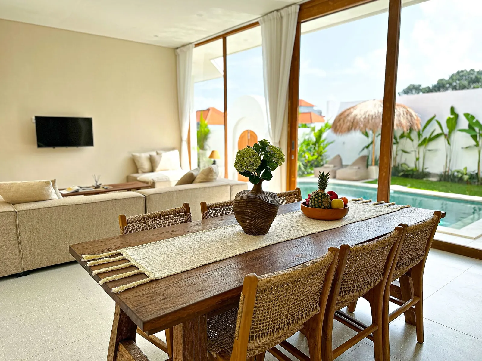 Dining and living area looking out to the pool