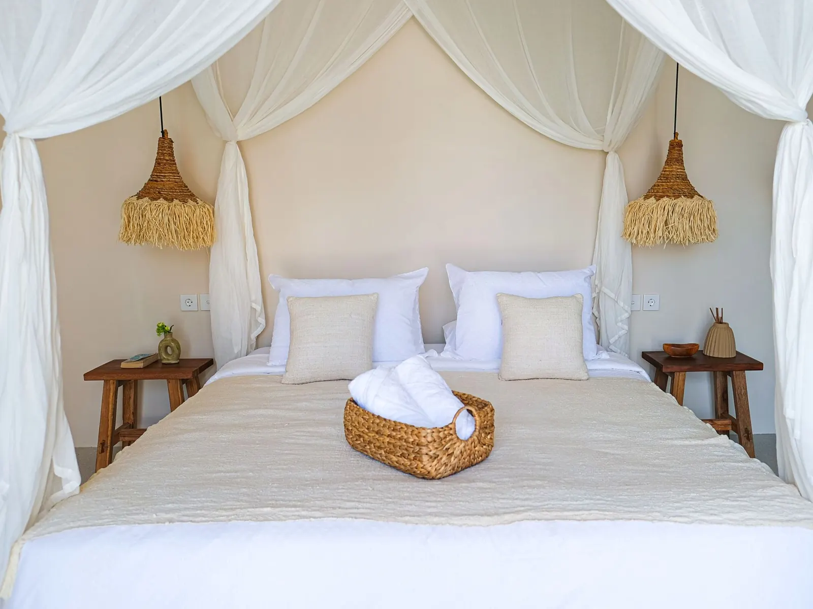 Canopy bed with rattan pendant lights