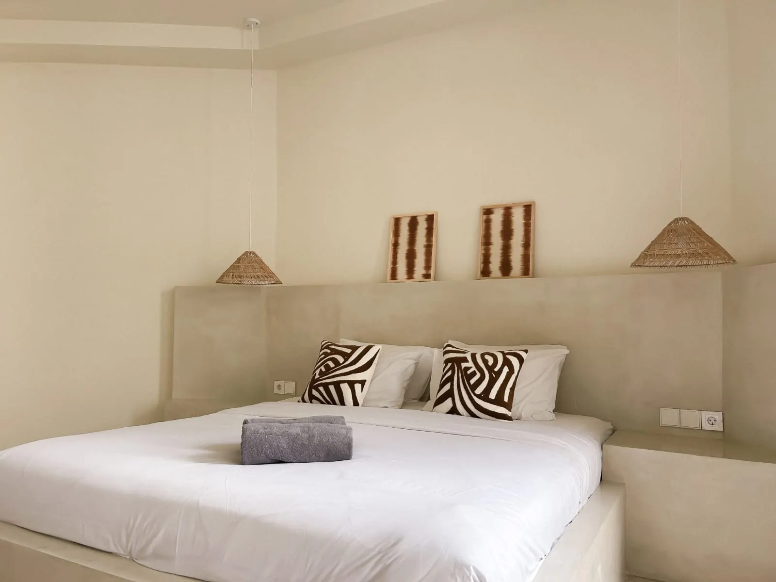 Second bedroom with platform bed and headboard ledge