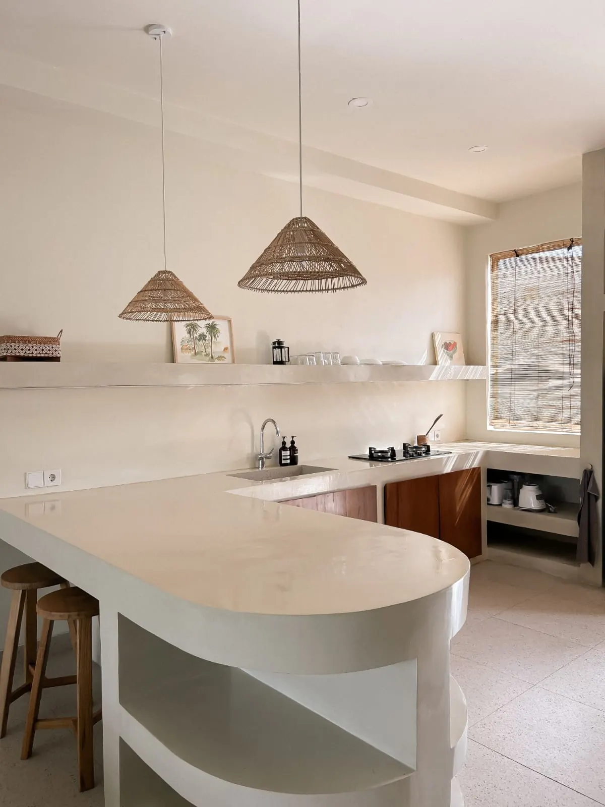 Curved micro-cement breakfast bar in the kitchen