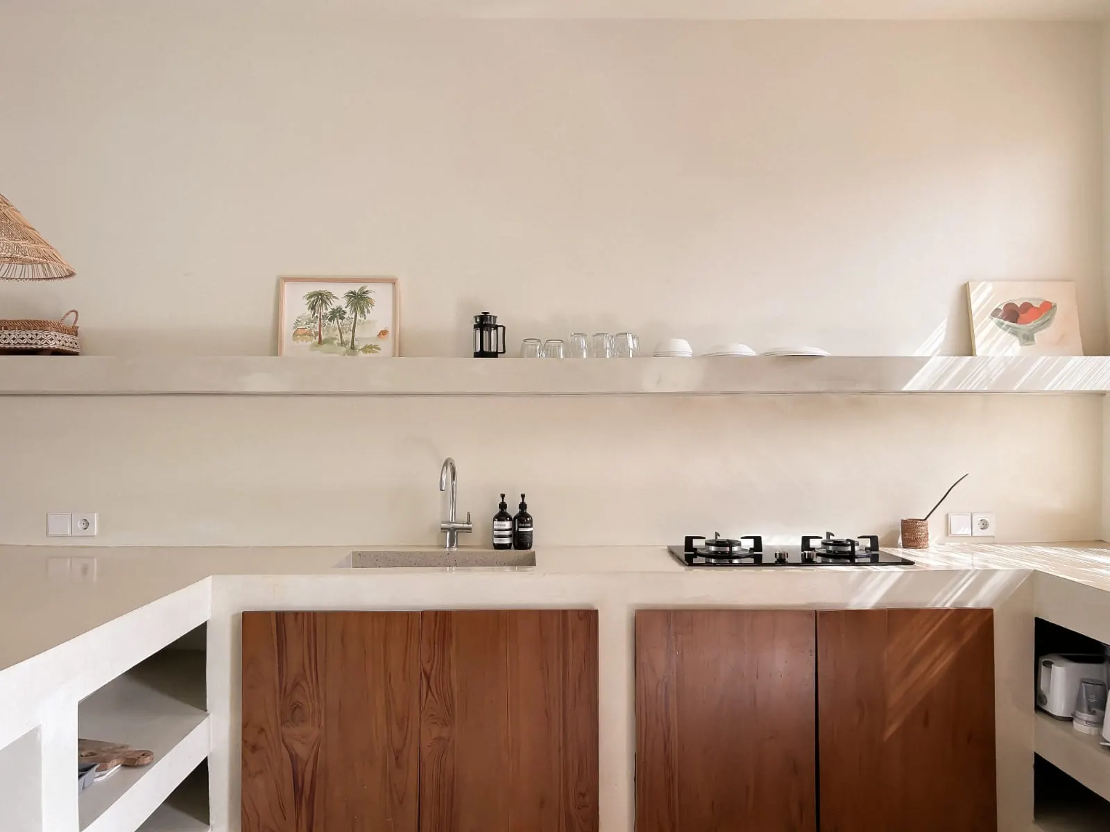 Kitchen with teak cabinets and gas hob