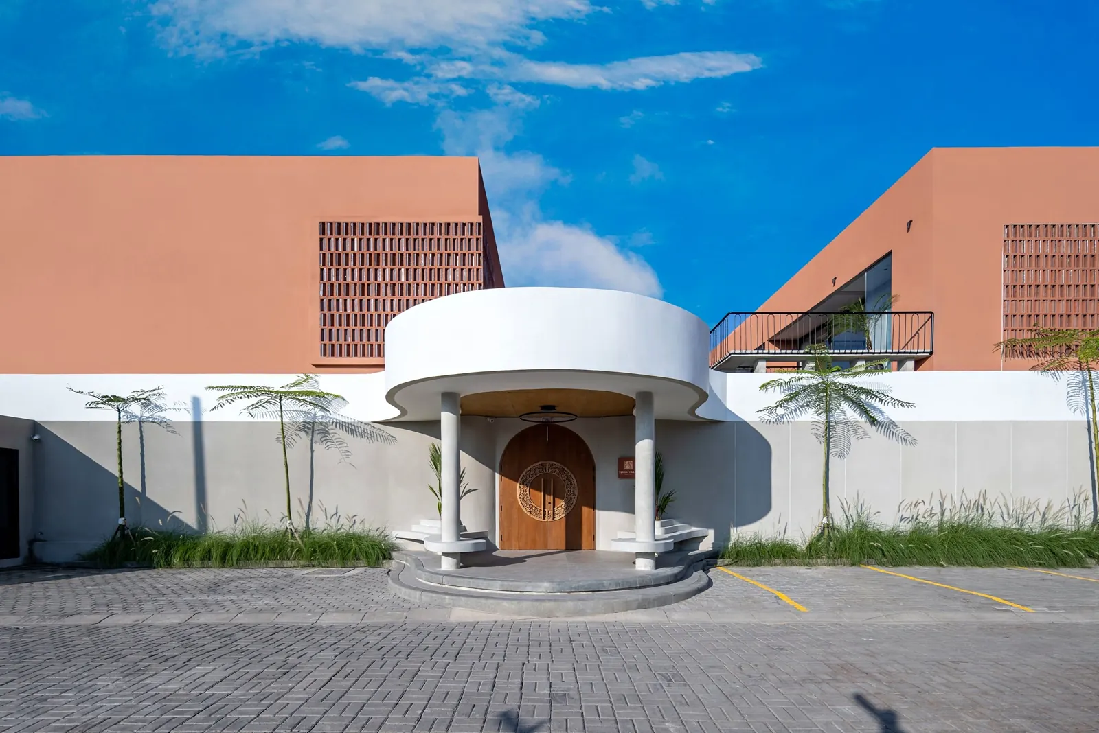 Villa entrance with arched wooden door