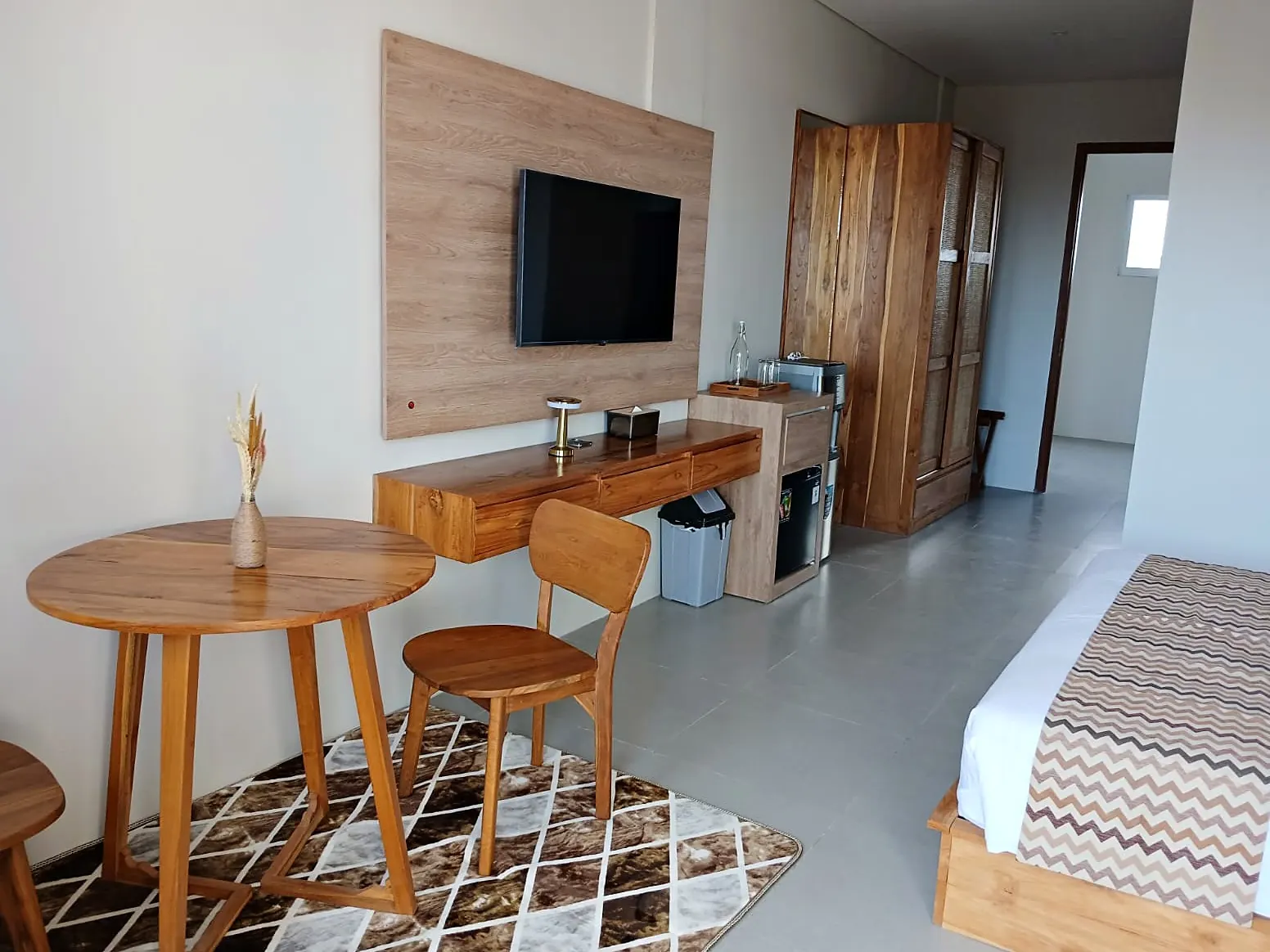 Dining table, TV wall and bed